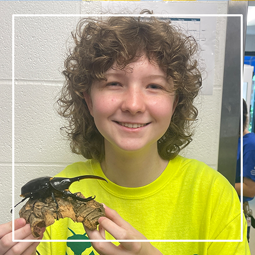 Teen holding insect